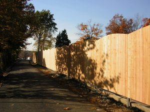 Wooden fencing around a yard. highway specialty contractors
