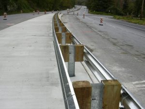 Steel guardrail on divided highway installed by Collinson Inc.